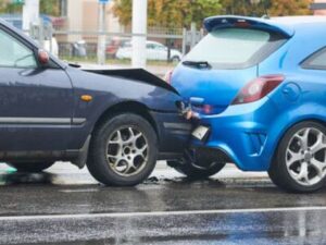 Two damaged cars involved in a rear-end collision