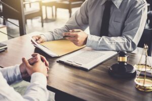 lawyer and client discussing about claiming for dog bite compensation using no win no fee.