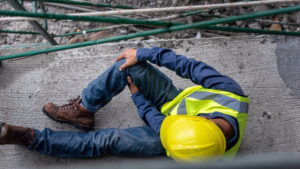 A construction worker has hurt his knee in an accident at work.